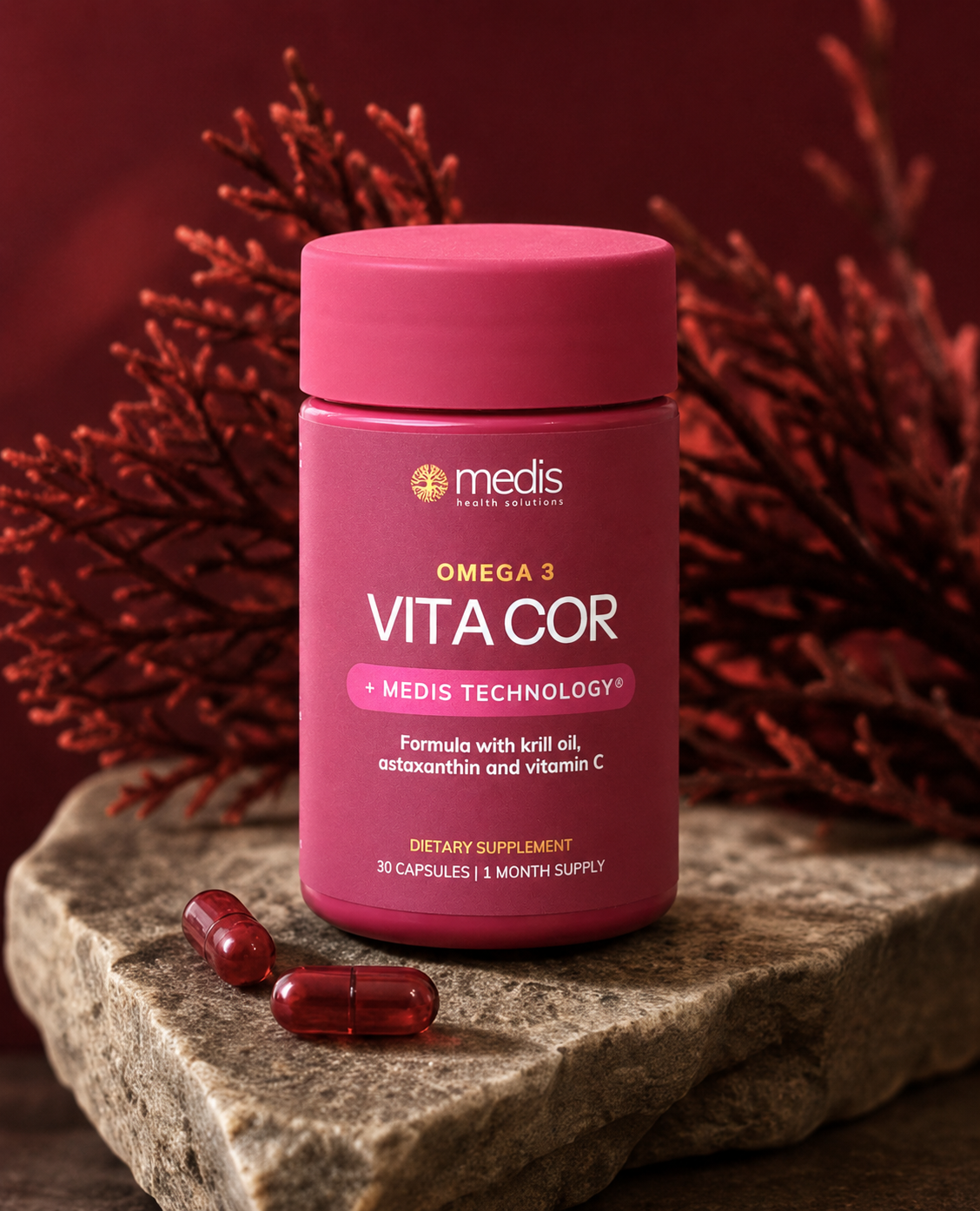 Pink bottle of Vita Cor dietary supplement with red capsules on a stone surface against a red background