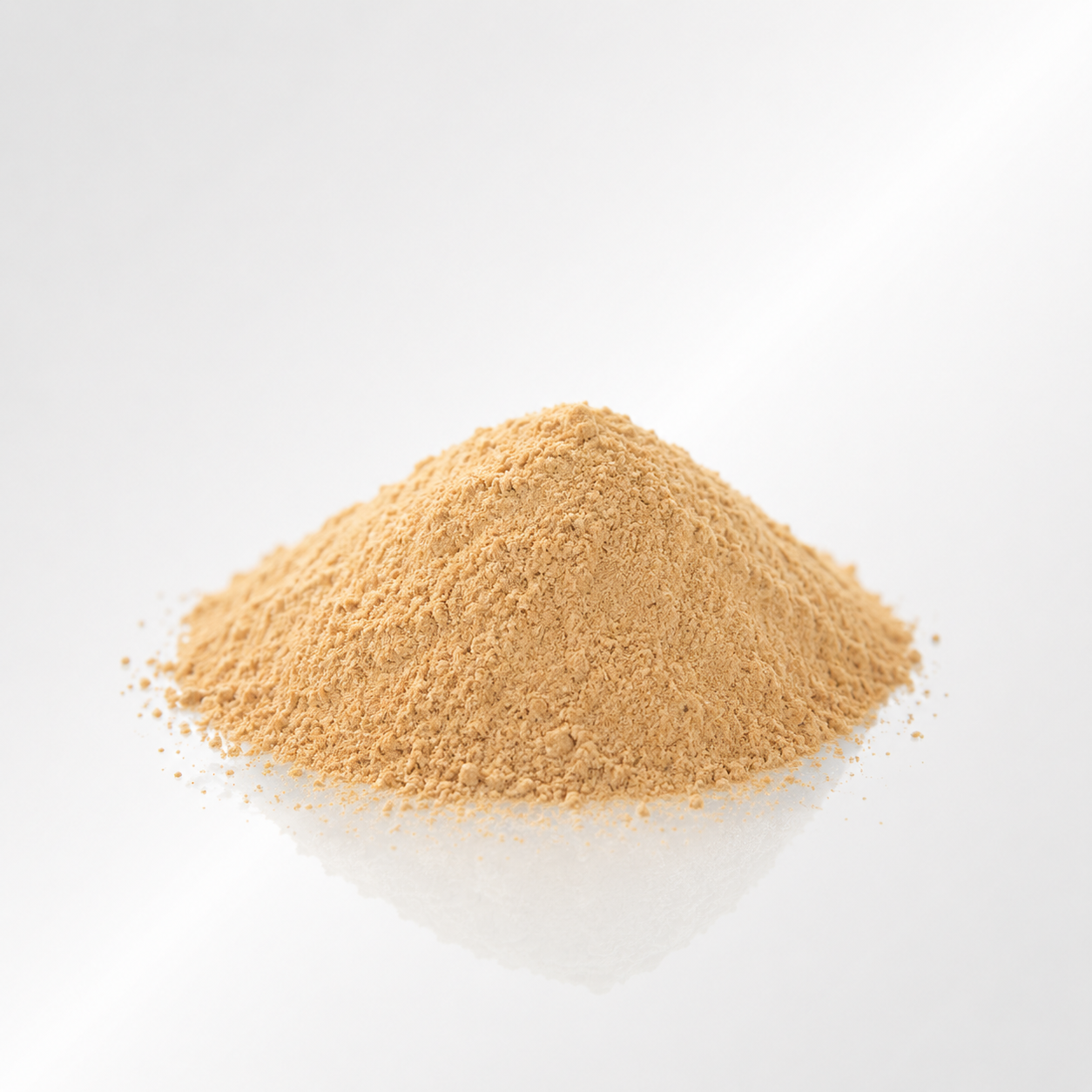 Heap of Nettle beige powder on a light gray background